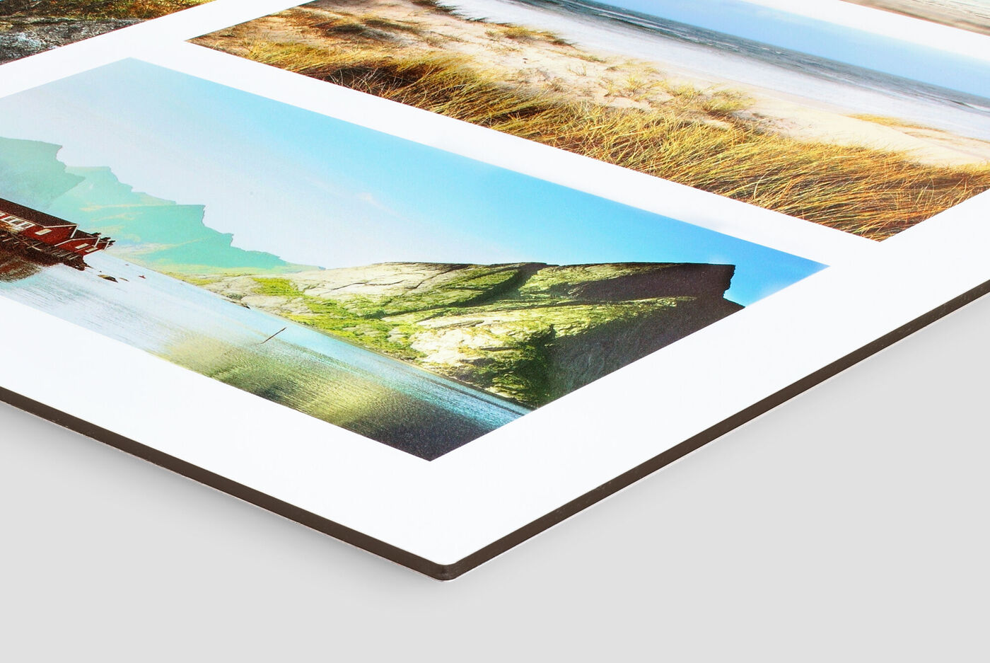Detailaufnahme eines Fotobuchs mit drei Bildern aus der Natur