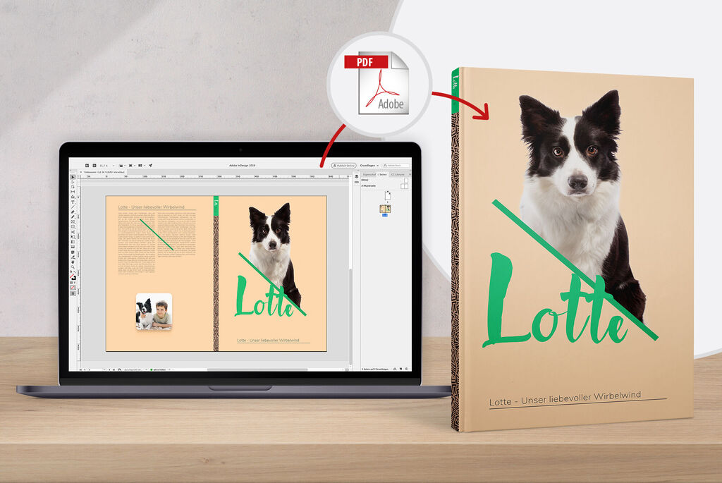 Ein Laptop zeigt eine Seite eines CEWE Fotobuchs mit einem Hund und dem Titel „Lotte“.